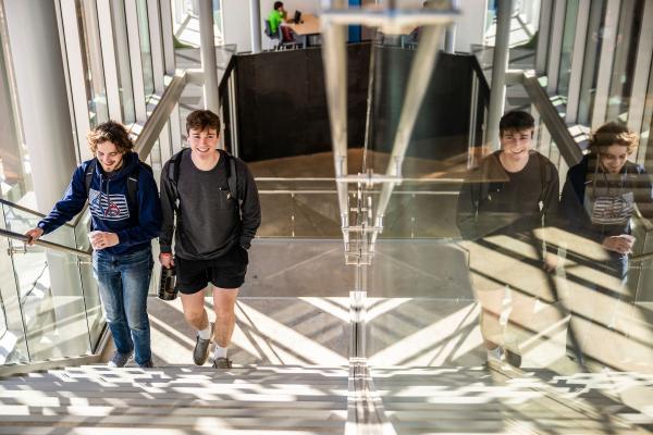 students ascending a staircase in the Innovation Lab